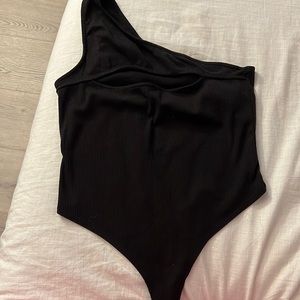 Black Fashion Nova body suit.